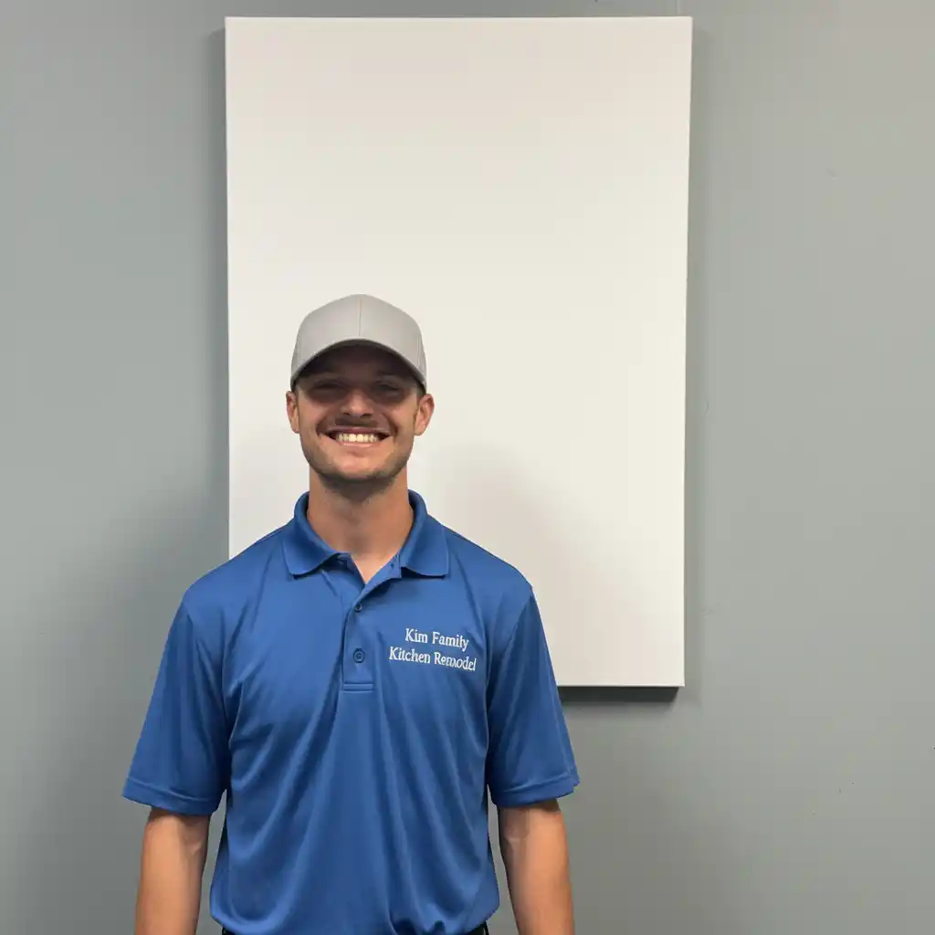 Harold Kimberly, Owner of Kim Family Kitchen Remodel, standing in front of company van